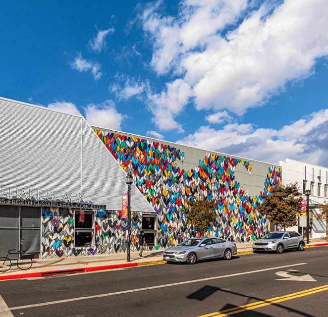Street view of a Downtown Burbank building featuring a large-scale mural