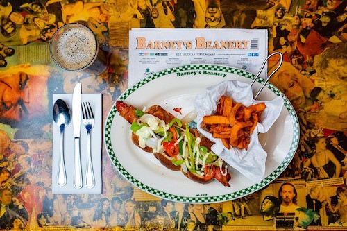 Barney's Beanery hotdog with menu on a table