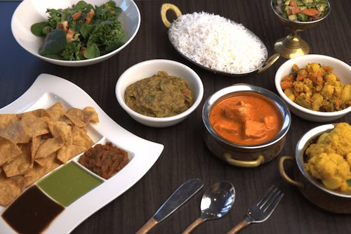 Flavor of India dishes arrayed on a table