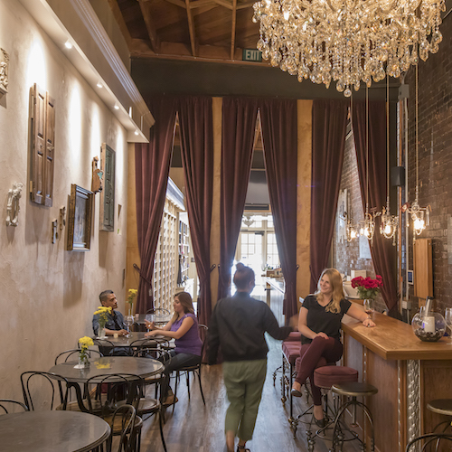 Urban Press Winery interior with bar and chandelier