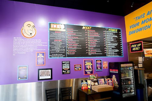 Ike's Sandwich menu on a purple wall