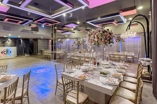 Olivia Restaurant ballroom set up for event with long tables