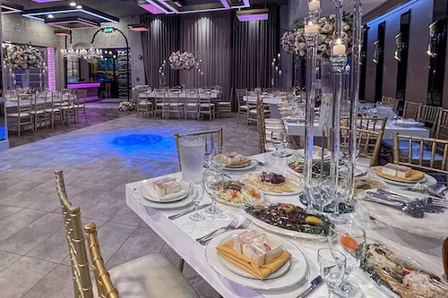 Olivia Restaurant ballroom with mediterranean food on table