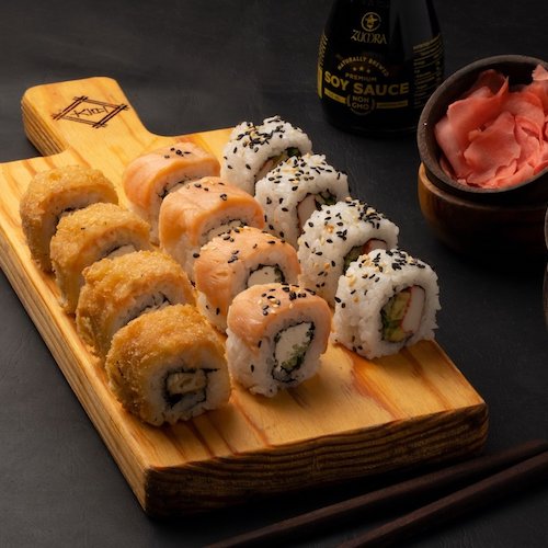 Sushi rolls on a wood cutting board