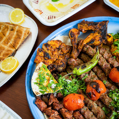 Mediterranean skirt steak on a blue plate