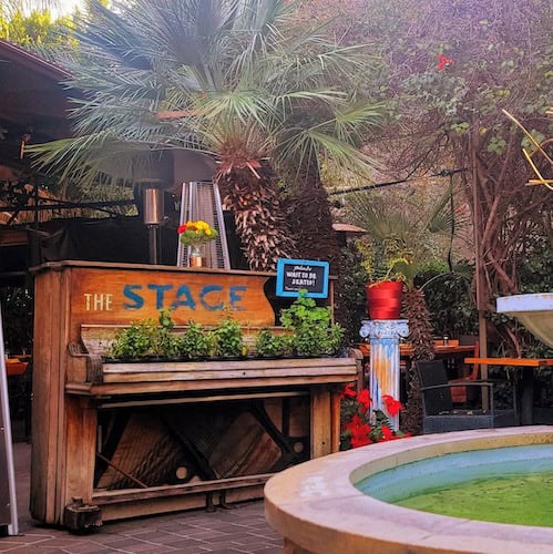 The stage piano with plants and fountain