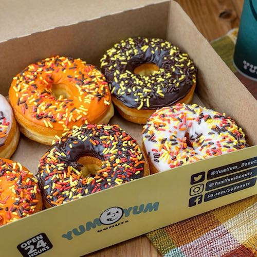 Sprinkle donuts in a Yum Yum box