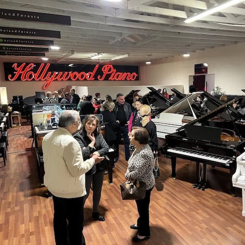 Hollywood Piano showroom full of people at an event