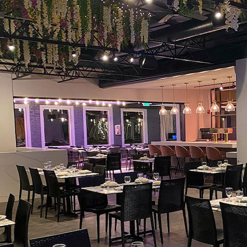 Terrace Restaurant dining room with black chairs and tables