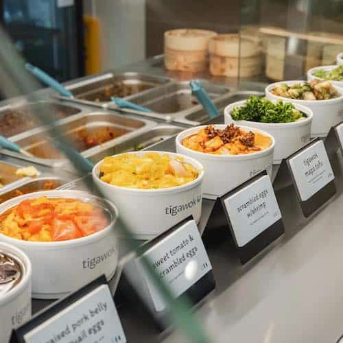 Row of Tigawok Chinese food mini bowls in a display case