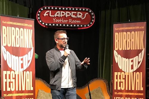 Comedian performing at the Burbank Comedy Festival on the Flappers Comedy Club stage