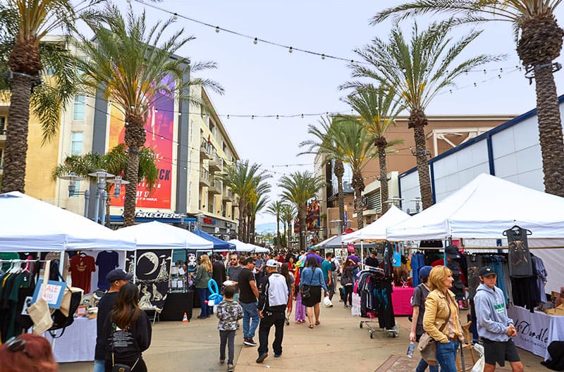 Downtown Burbank Cultural Market tents and artisans lining AMC Walkway