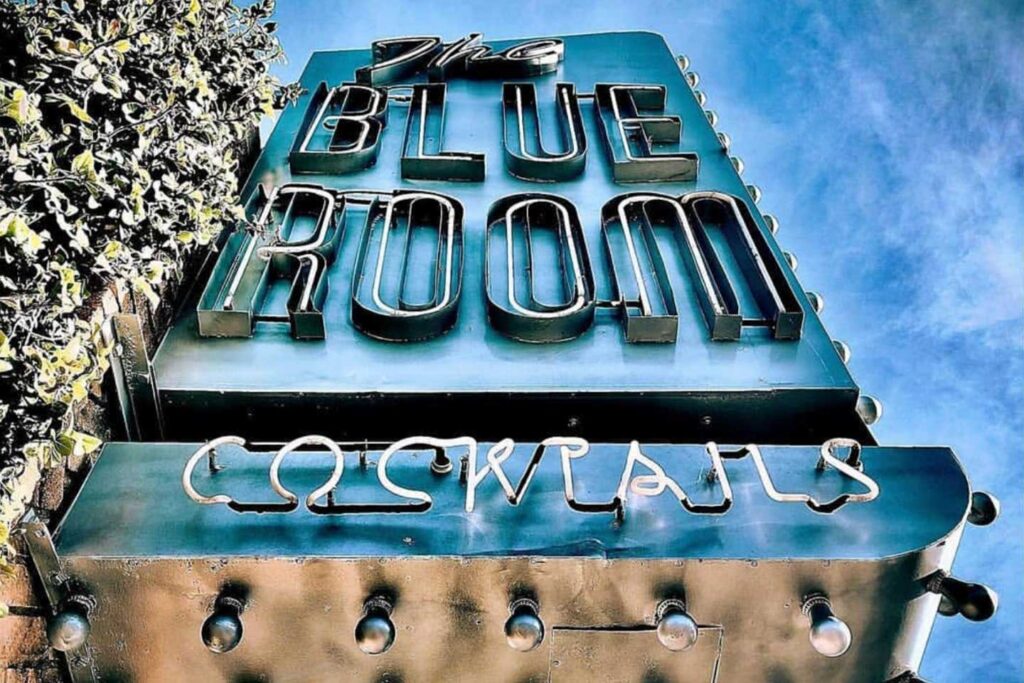 Retro neon sign for The Blue Room Cocktails bar, perfect for a night out or St. Patrick's Day drinks.